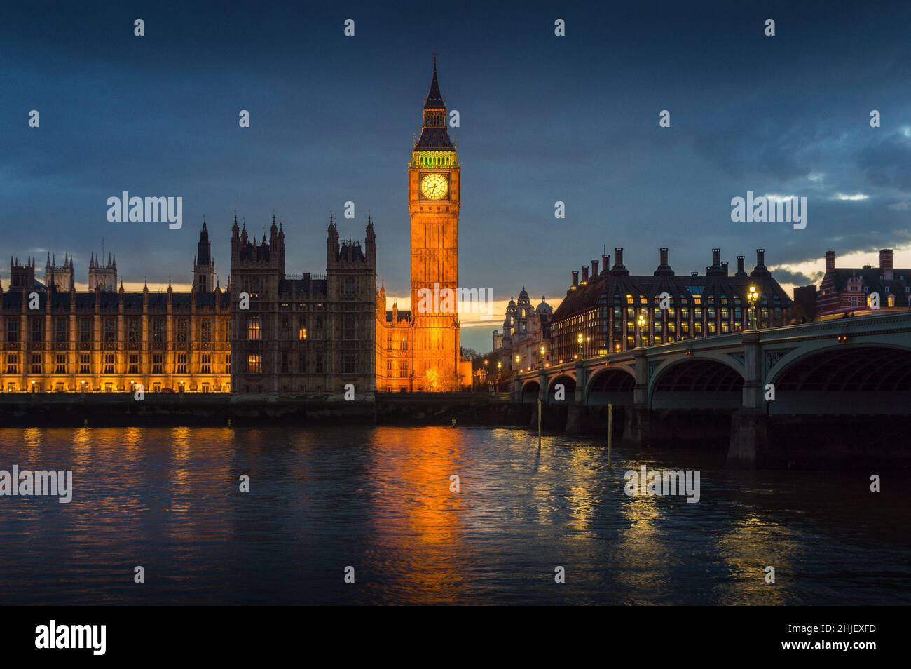 View on old London City centre over river Thames at blue hour, London, United Kingdom Stock Photo