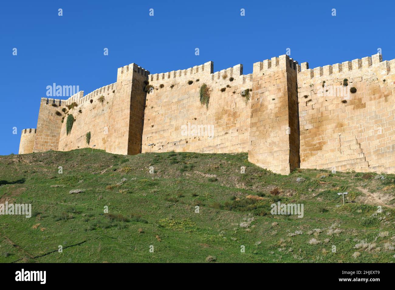 Fortress wall with towers on a sunny September day. Ancient fortress of Naryn-Kala in Derbent. Republic of Dagestan, Russian Federation Stock Photo