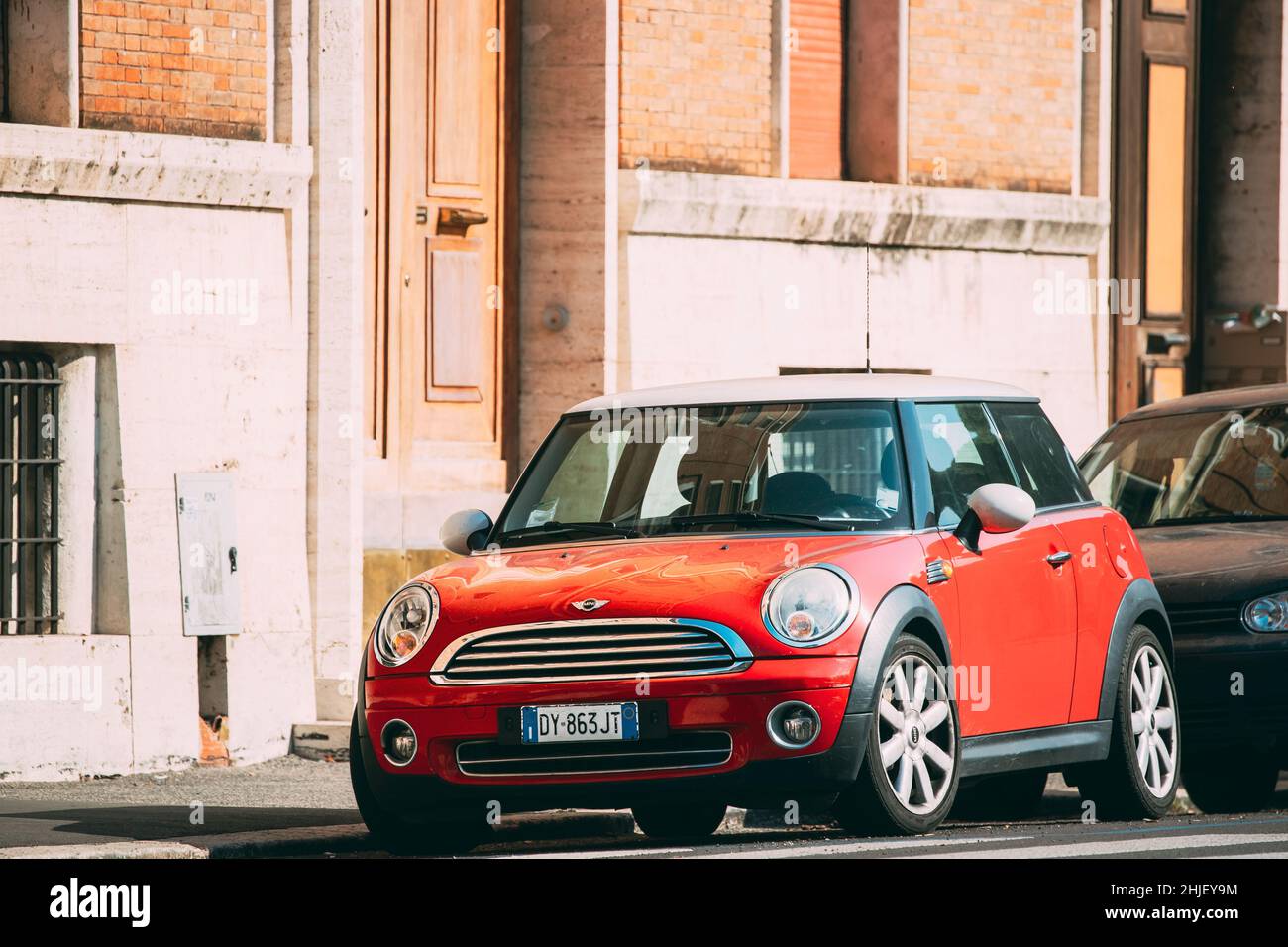 Rome, Italy. Red Mini Cooper Hatch Car Of Second Generation Parked At Street Stock Photo