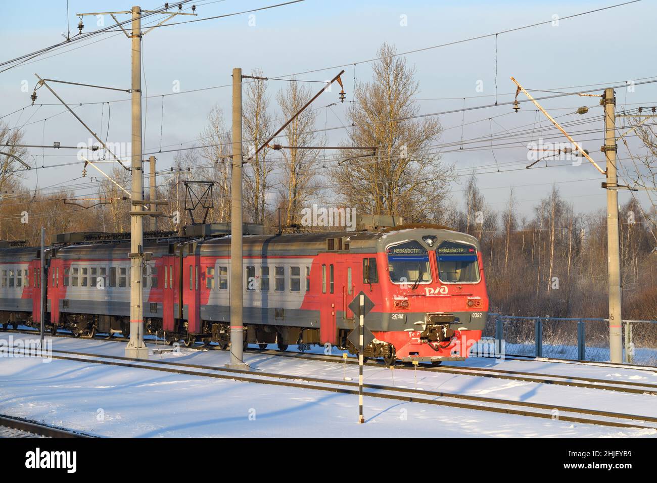 LENINGRAD REGION, RUSSIA - DECEMBER 21, 2021: Electric train ED4M on the spare tracks of a suburban station on December afternoon Stock Photo