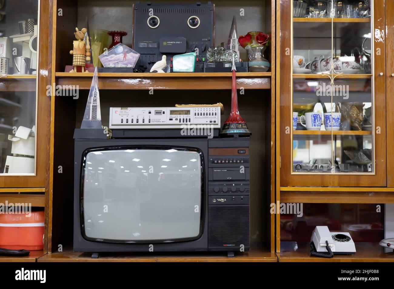 Russia, Sochi 22.01.2021. An old Soviet TV stands in retro cabinet with old-fashioned decor. Vintage decoration of the USSR Stock Photo