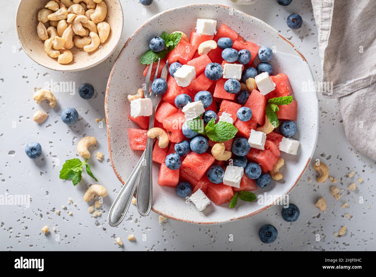 Juicy watermelon salad made of healthy and fresh ingredients. Summer