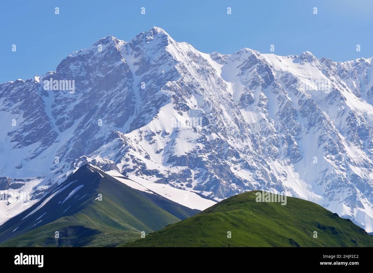 Mountain landscape with snow-covered peak. Shkhara Mountain, Georgia, Greater Caucasus Range Stock Photo