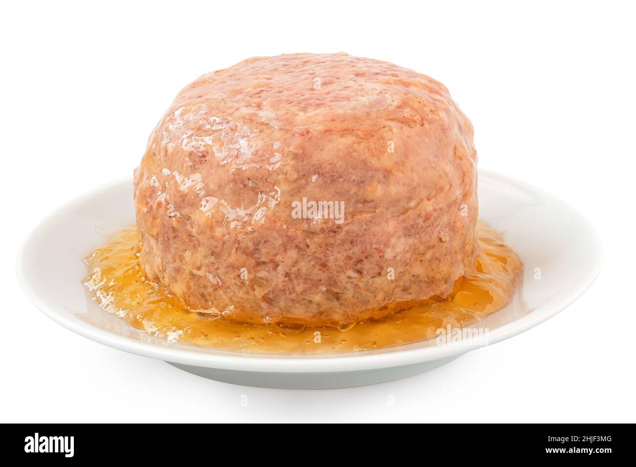 Canned pork luncheon meat surrounded by jelly on white plate isolated