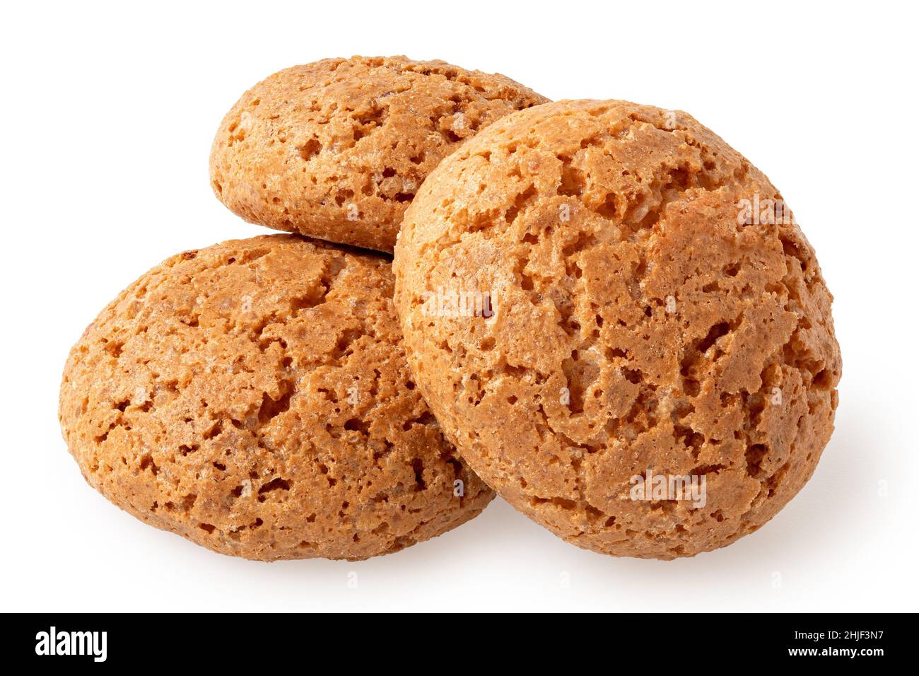 Three whole amaretti biscuits isolated on white. Stock Photo