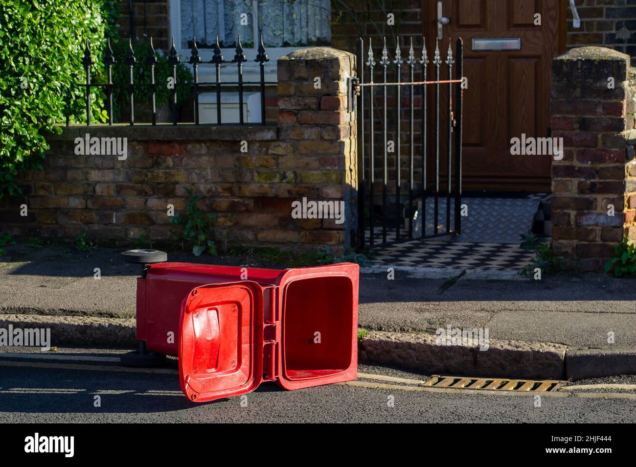 Slough, Berkshire, UK. 29th January, 2022. There were strong wind gusts in Slough today which managed to blow over a number of wheelie bins that had been emptied earlier. Credit: Maureen McLean/Alamy Live News Stock Photo