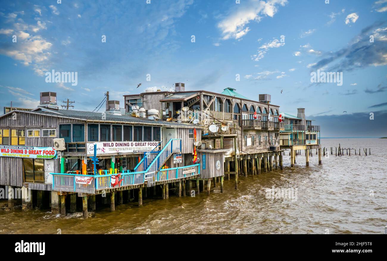Dock Street restaurants and shops on stilts over water on in Cedar Key