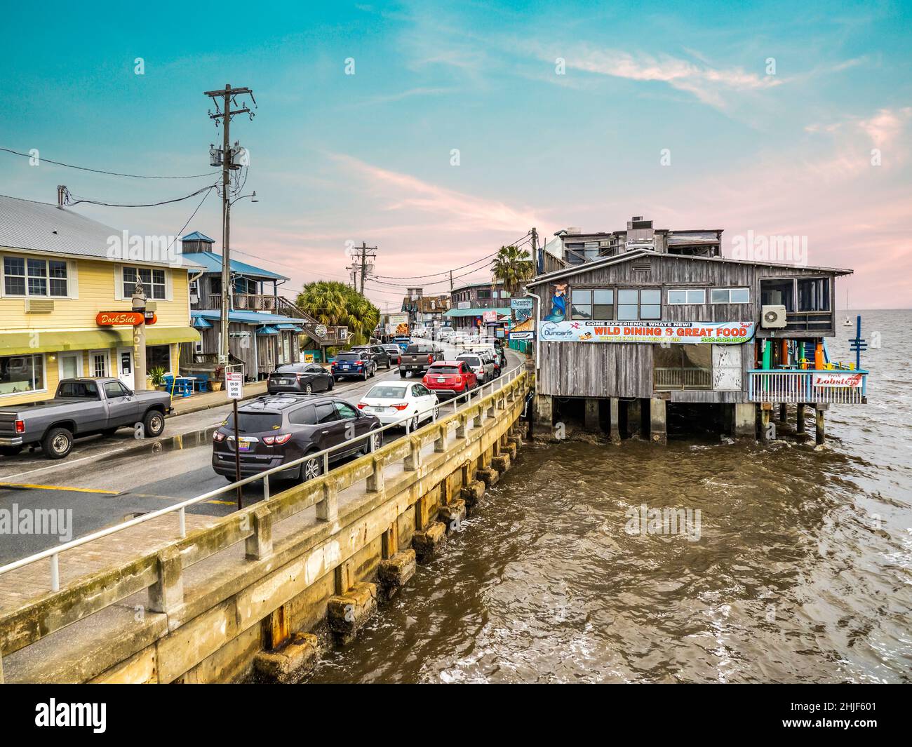 Dock Street restaurants and shops on stilts over water on in Cedar Key Florida USA Stock Photo