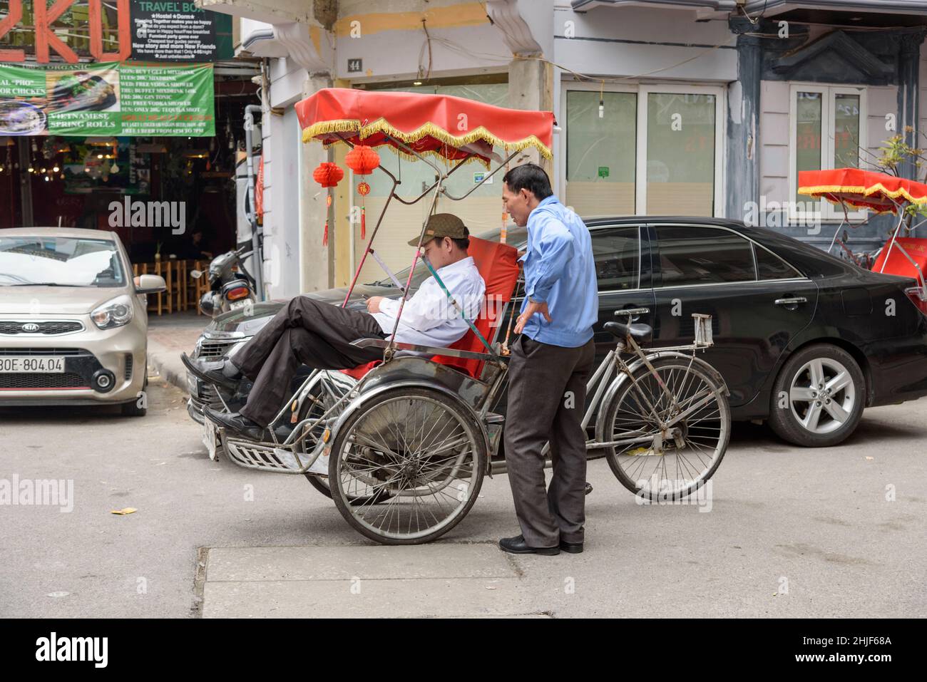Bicycle rickshaw (cyclo or pedicab) in the streets of the Old Quarter ...