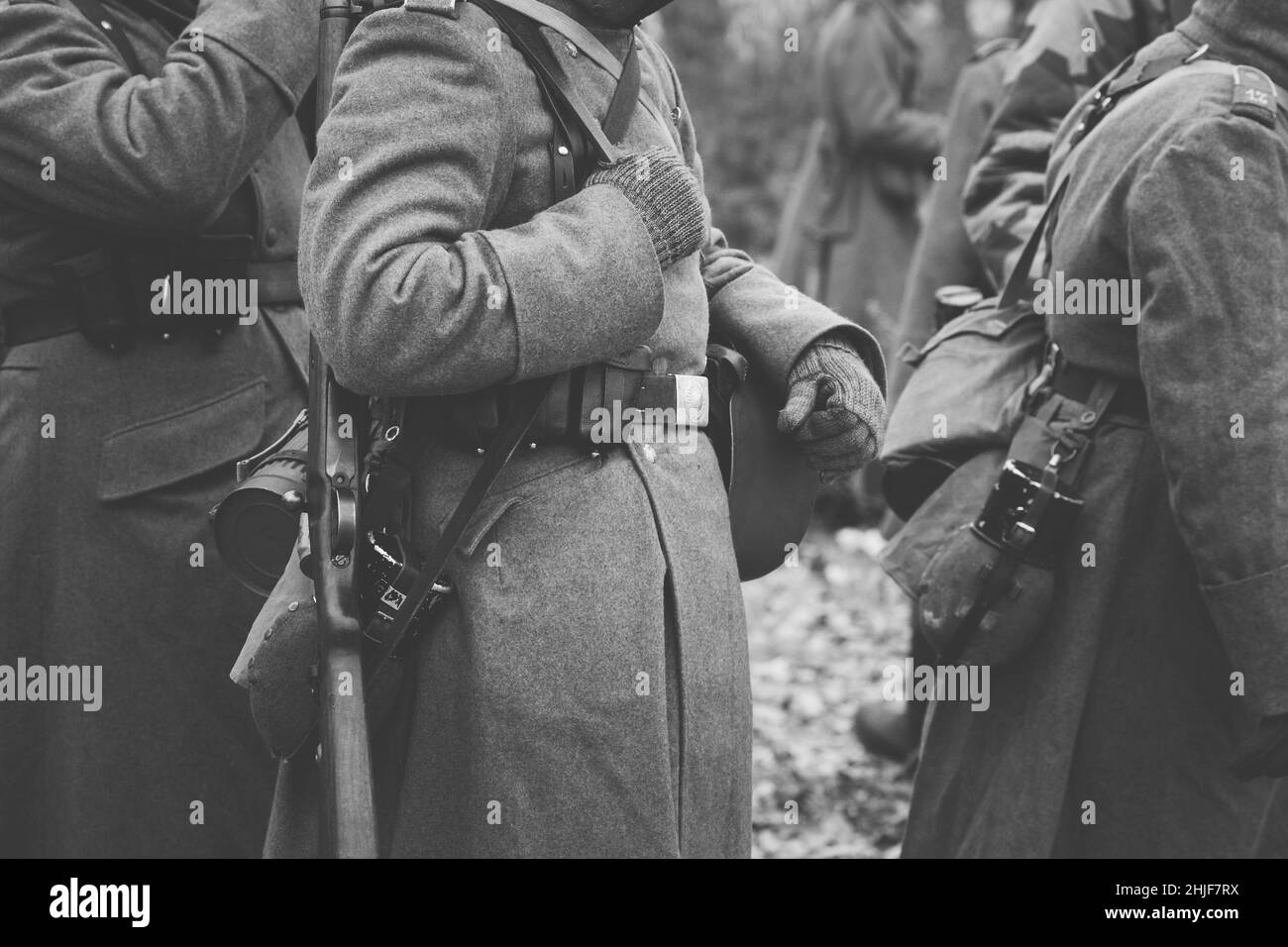 German military ammunition of a German soldier at World War II. Warm autumn clothes, soldier's overcoat, gloves, helmet, pouch, sapper shovel, flask Stock Photo