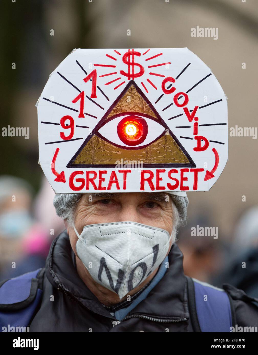 Freiburg, Germany. 29 January 2022, Lower Saxony, Osnabrück: A 'Great Reset' banner is held by a participant in a demonstration. The participants demonstrate against the Corona policy. Credit: dpa picture alliance/Alamy Live News Stock Photo