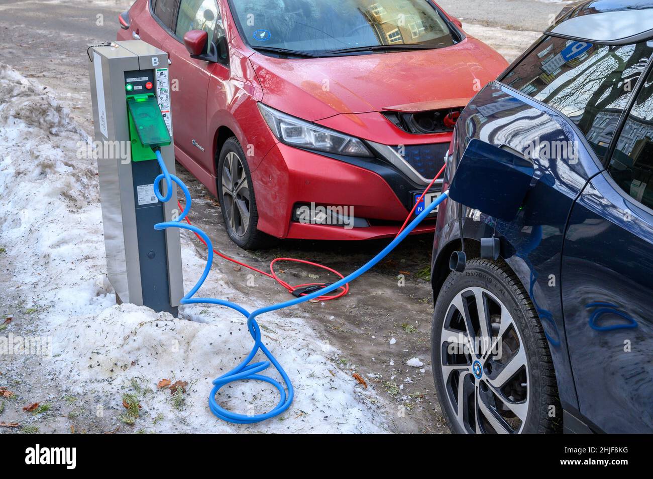 Public charging points for electric vehicles on a residential street in Oslo, Norway in winter, January 2022. Stock Photo