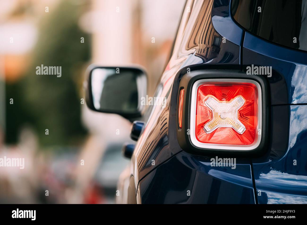 Terracina, Italy. Red Led Rear Lights Of Blue Jeep Renegade Bu/520 Car Parking At Street. Back