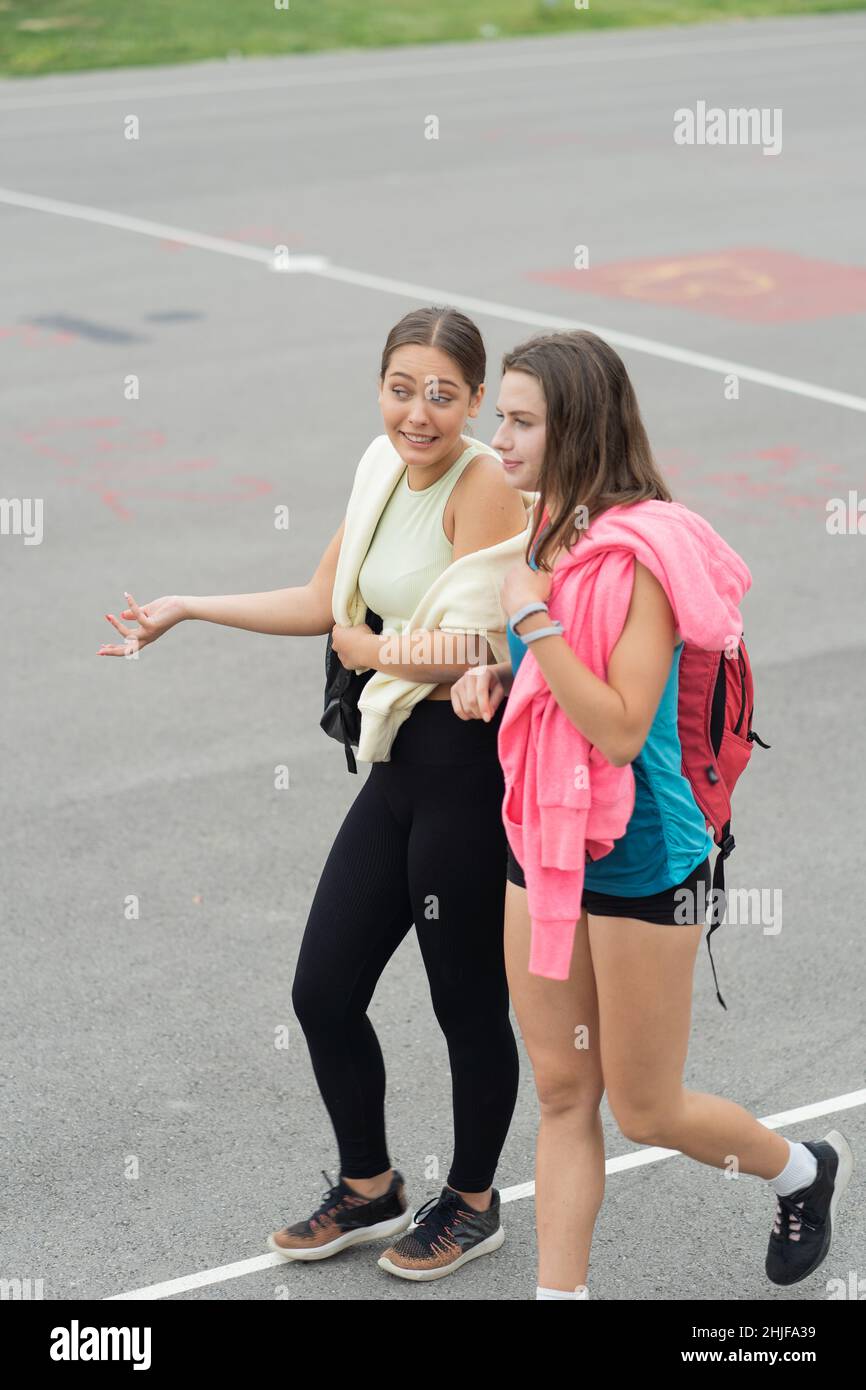 Two girls models walking hi-res stock photography and images - Alamy