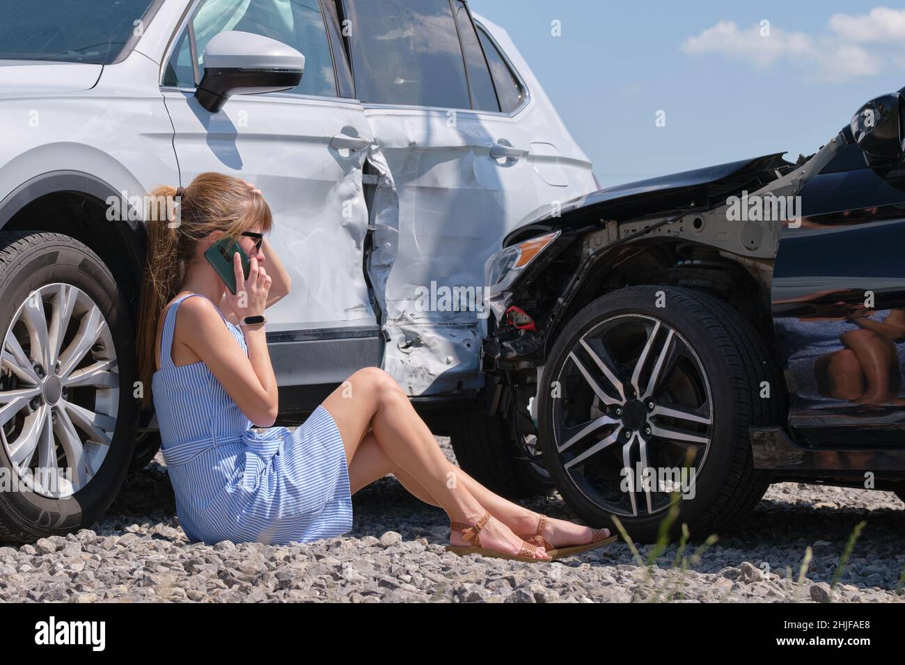 Stressed woman driver talking on mobile phone on street side calling ...