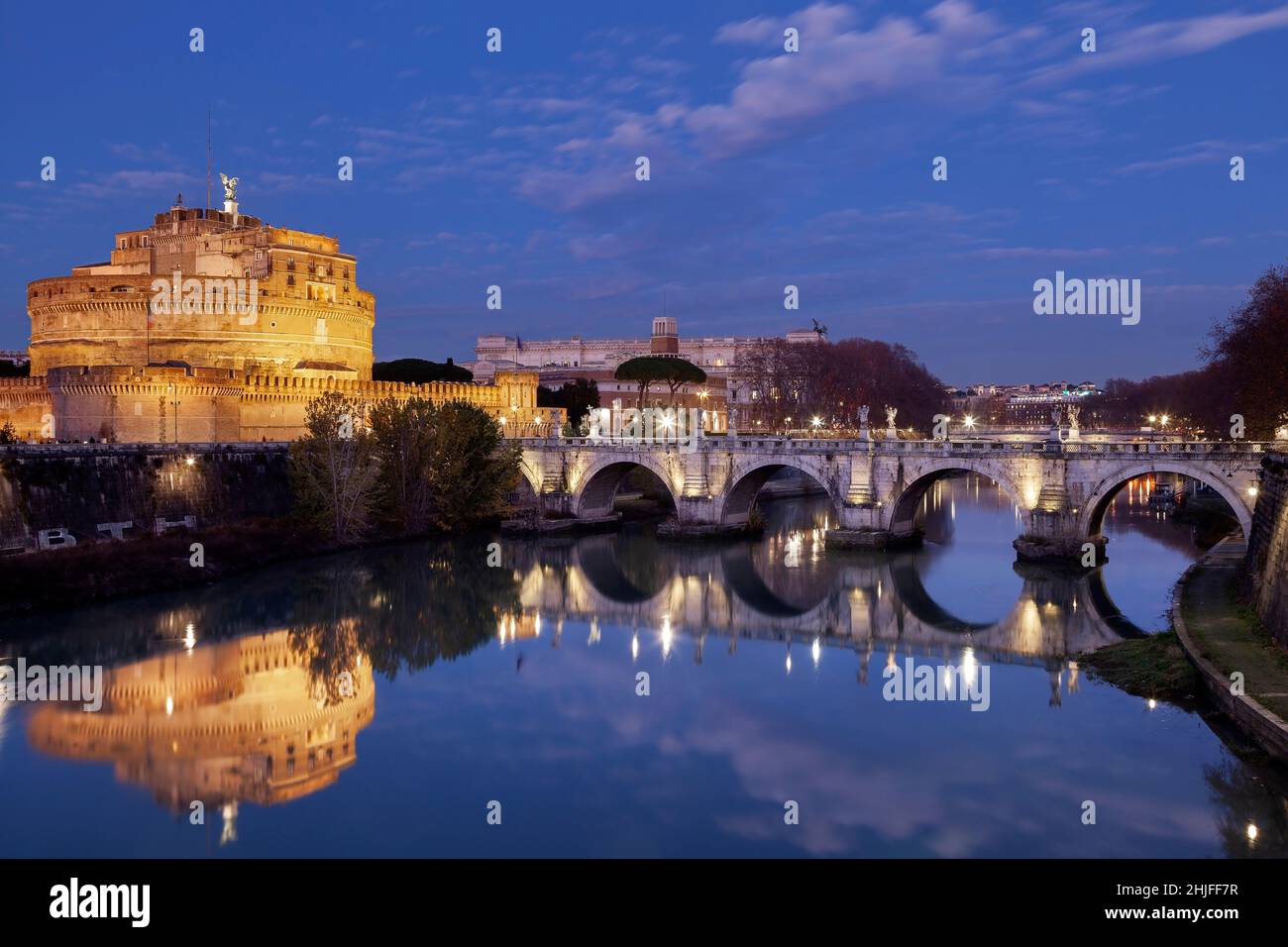 Night falling over Tiber river, Castel Sant'Angelo and Ponte Sant'Angelo of the Vatican City, in Rome, Italy, Europe. Stock Photo