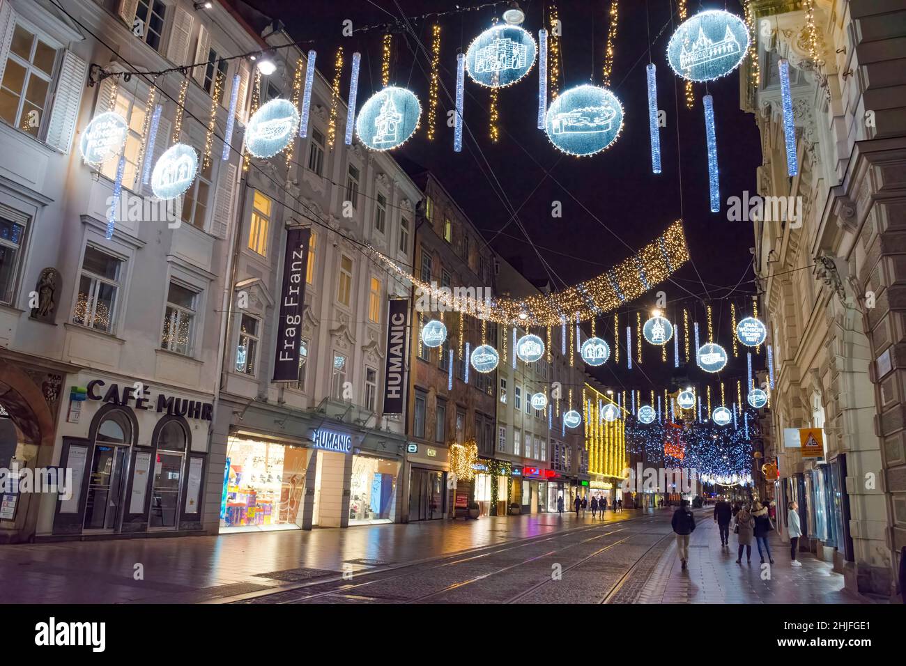 Graz, Austria-December 02, 2021: Beautiful Christmas decorations and lights on famous Herrengasse street, at night, in the city center of Graz Stock Photo