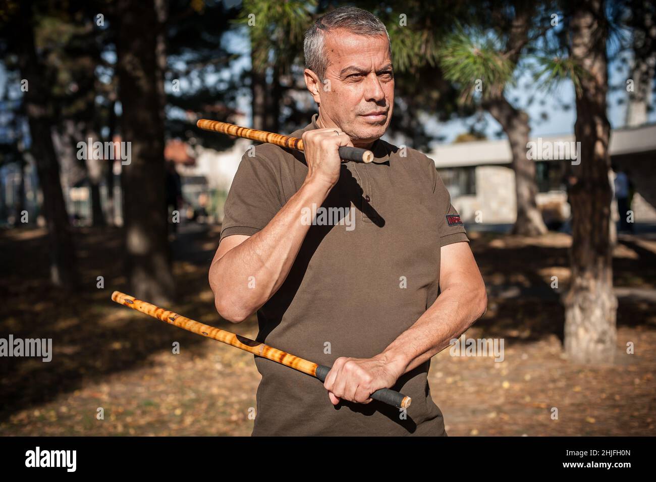 Escrima and kapap instructor demonstrates sticks fighting