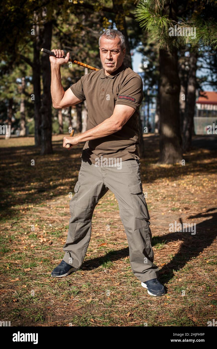 Escrima and kapap instructor demonstrates sticks fighting