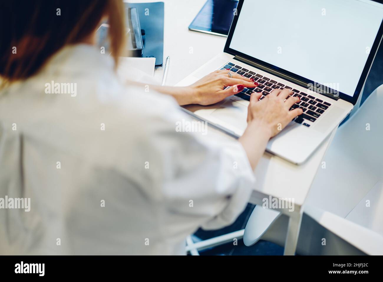 Unrecognizable remote worker using computer at workplace Stock Photo