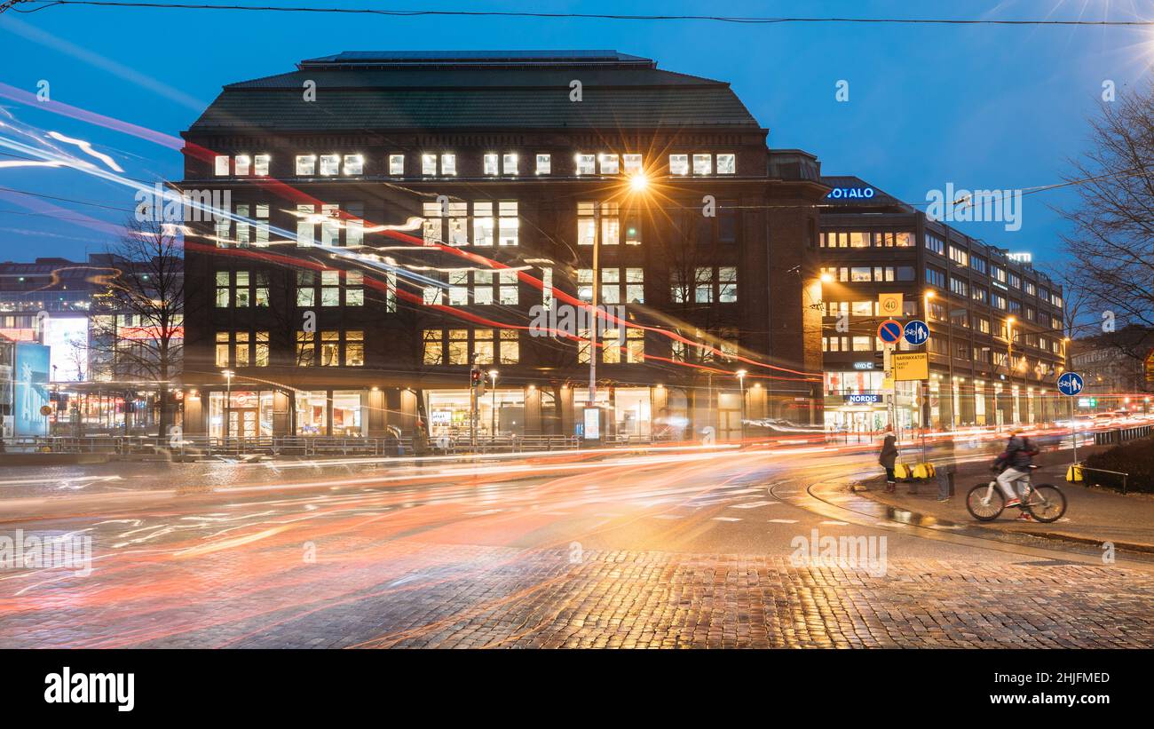 Helsinki, Finland. Building On The Corner Of Arkadiankatu Street And Mannerheimintie Or Mannerheim Avenue In Evening Night Illumination Stock Photo