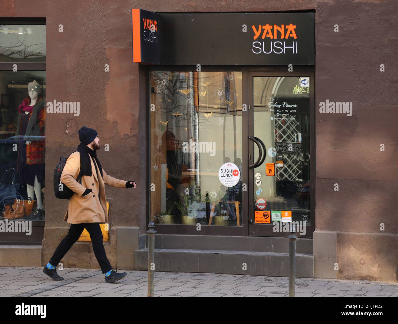 Cracow. Krakow. Poland. Yana Sushi japanese restaurant signboard on the facade. Stock Photo