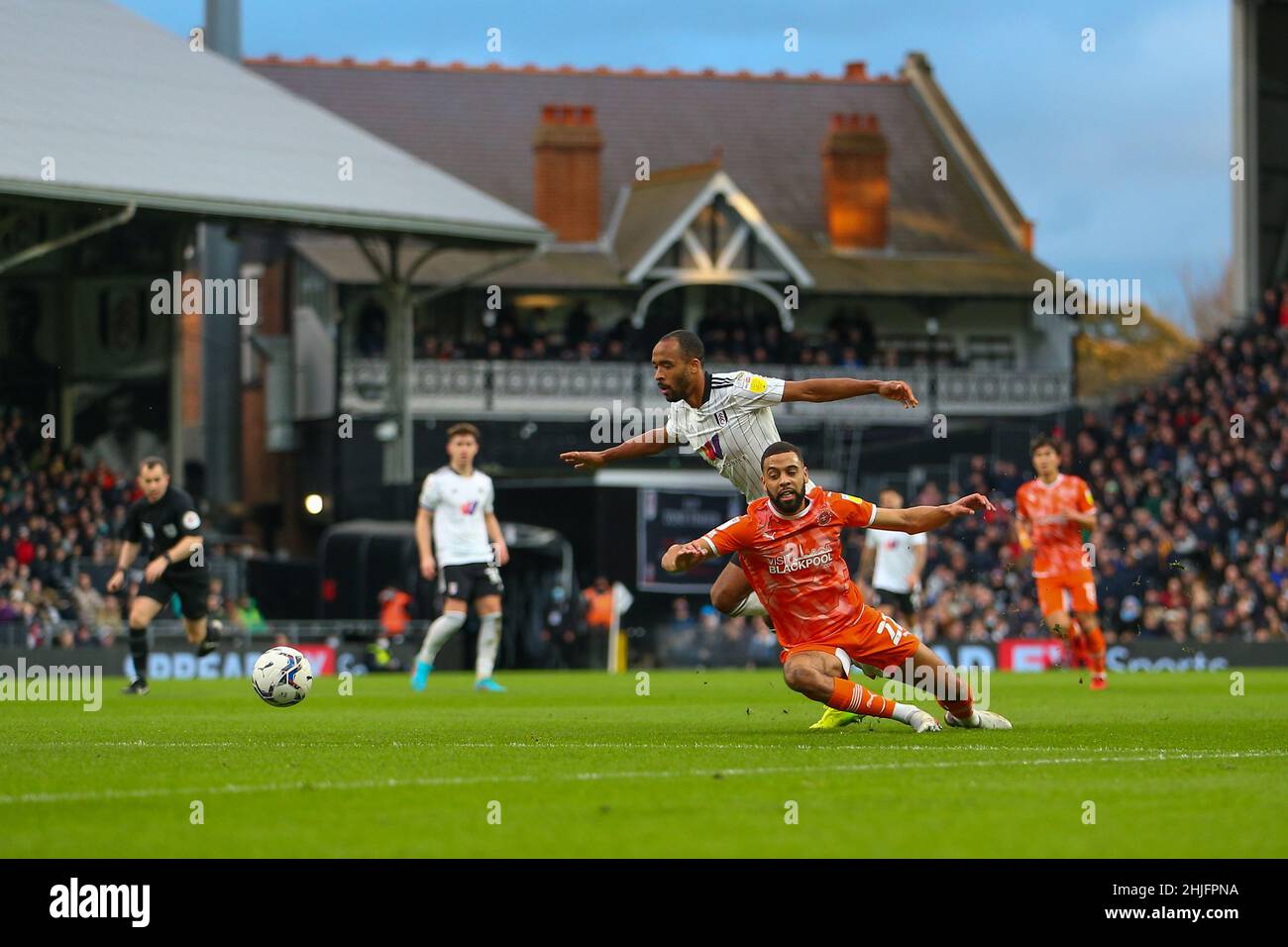 Craven Cottage, Fulham, London, UK. 29th Jan, 2022. EFL Championship football, Fulham versus Blackpool; Denis Odoi of Fulham fouls CJ Hamilton of Blackpool just outside the penalty area for a free kick to Blackpool. Credit: Action Plus Sports/Alamy Live News Stock Photo