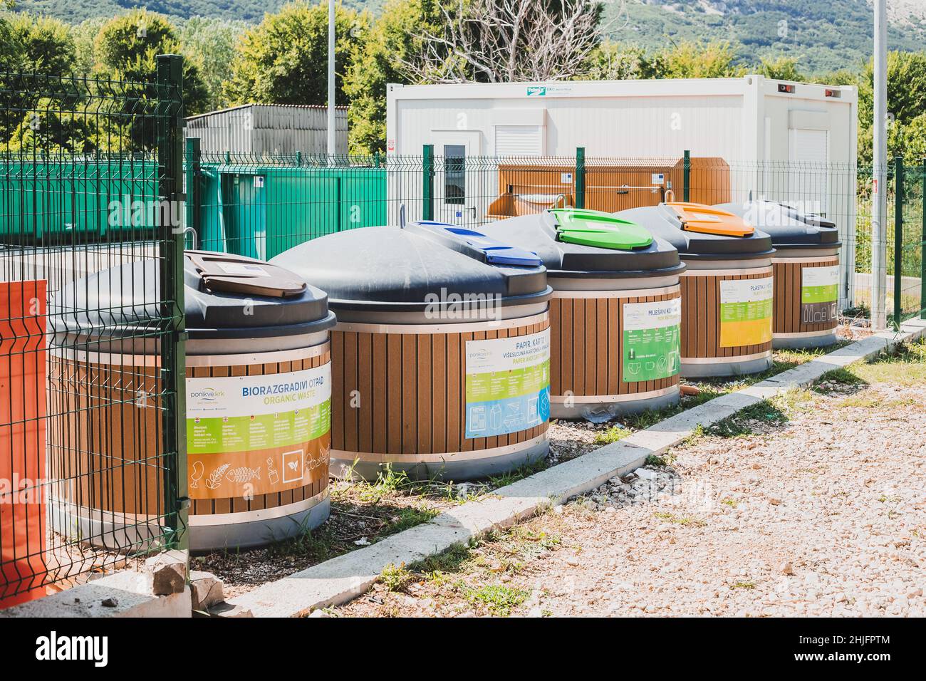 Krk, Croatia - 24 August, 2021: Containers with different types of waste at city waste sorting centre Stock Photo