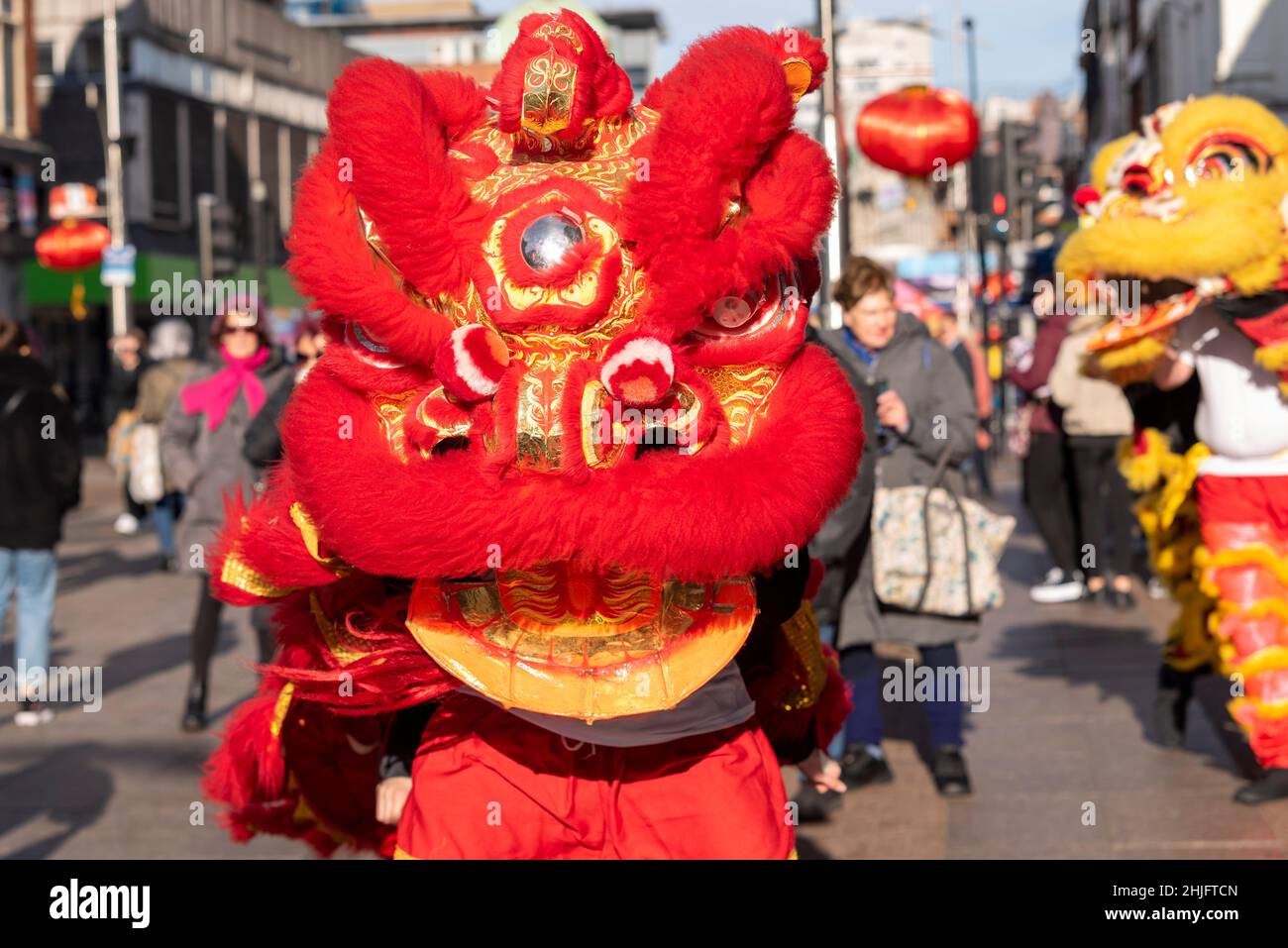 Lion dancers at Chinese New Year 2022, Lunar New Year celebration event in the High Street, Southend on Sea, Essex, UK. Traditional costumes Stock Photo