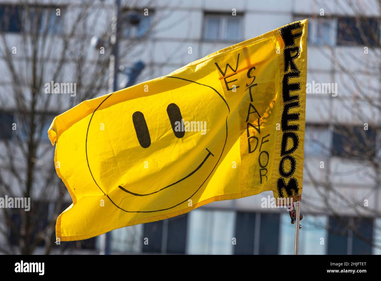 Flag at a English Constitution Party Freedom Rally promoting Graham Moore for the Southend West by-election 2022. Iconic yellow smiley face symbol Stock Photo