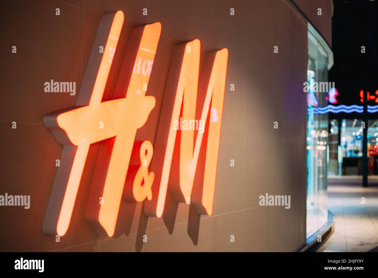 Close Red Logotype H&M Of Hennes & Mauritz Brand At Wall Of Store In Shopping Center. Stock Photo