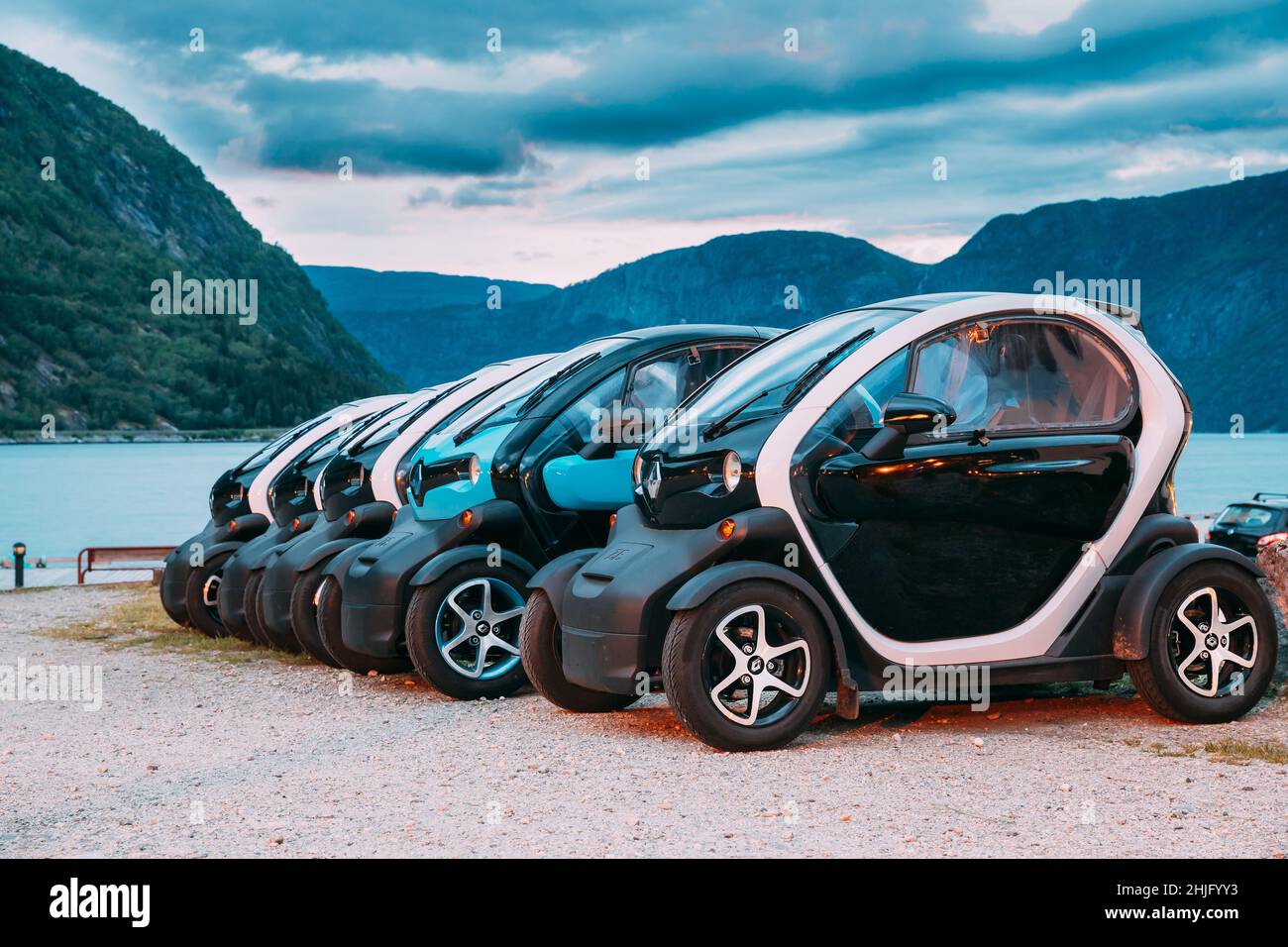 Many Black And Blue Colors Renault Z.E. Cars Parked In row. The Renault Z.E. or Zero Emission is a line of all-electric cars from Renault Stock Photo