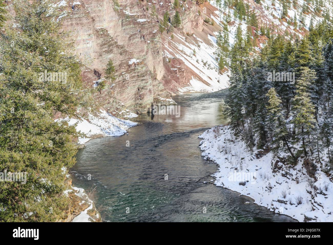 clark fork river flowing through alberton gorge in winter near alberton, montana Stock Photo