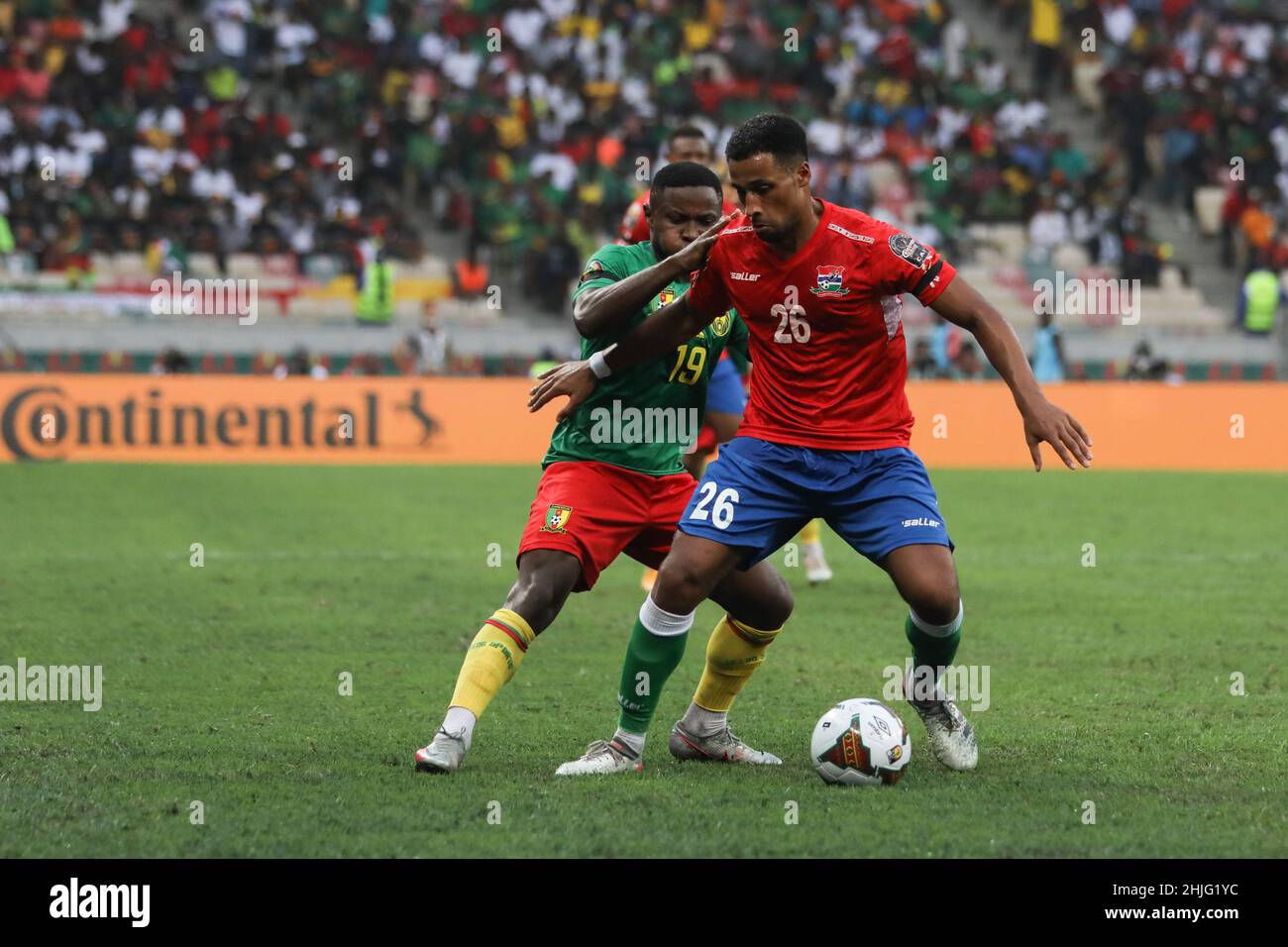 Cameroon, Douala, 29 January 2022 - Collins Fai of Cameroon and Ibou Touray of Gambia in action during the Africa Cup on Nations Play Offs - Quarter-finals match between Gambia and Cameroon at Japoma Stadium, Douala, Cameroon 29/01/2022 Photo SF Credit: Sebo47/Alamy Live News Stock Photo