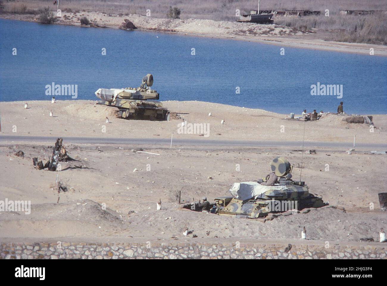 Military tanks alongside the Suez Canal, south of Ismailia, February 1978 Stock Photo