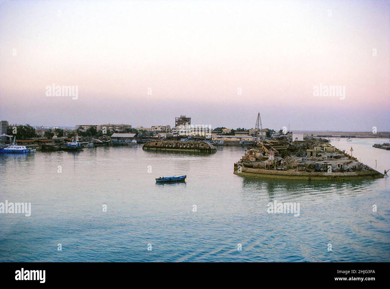 Possibly Port Taofik or Port Tawfiq, Suez, with wrecked boats dredged from the canal, February 1978 Stock Photo