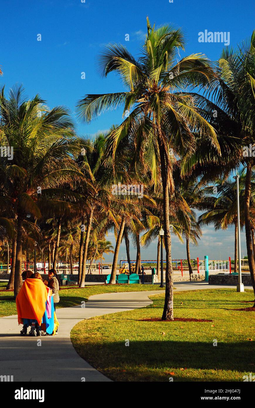 Young children keep bundled on an unusually brisk morning in Miami Beach Stock Photo