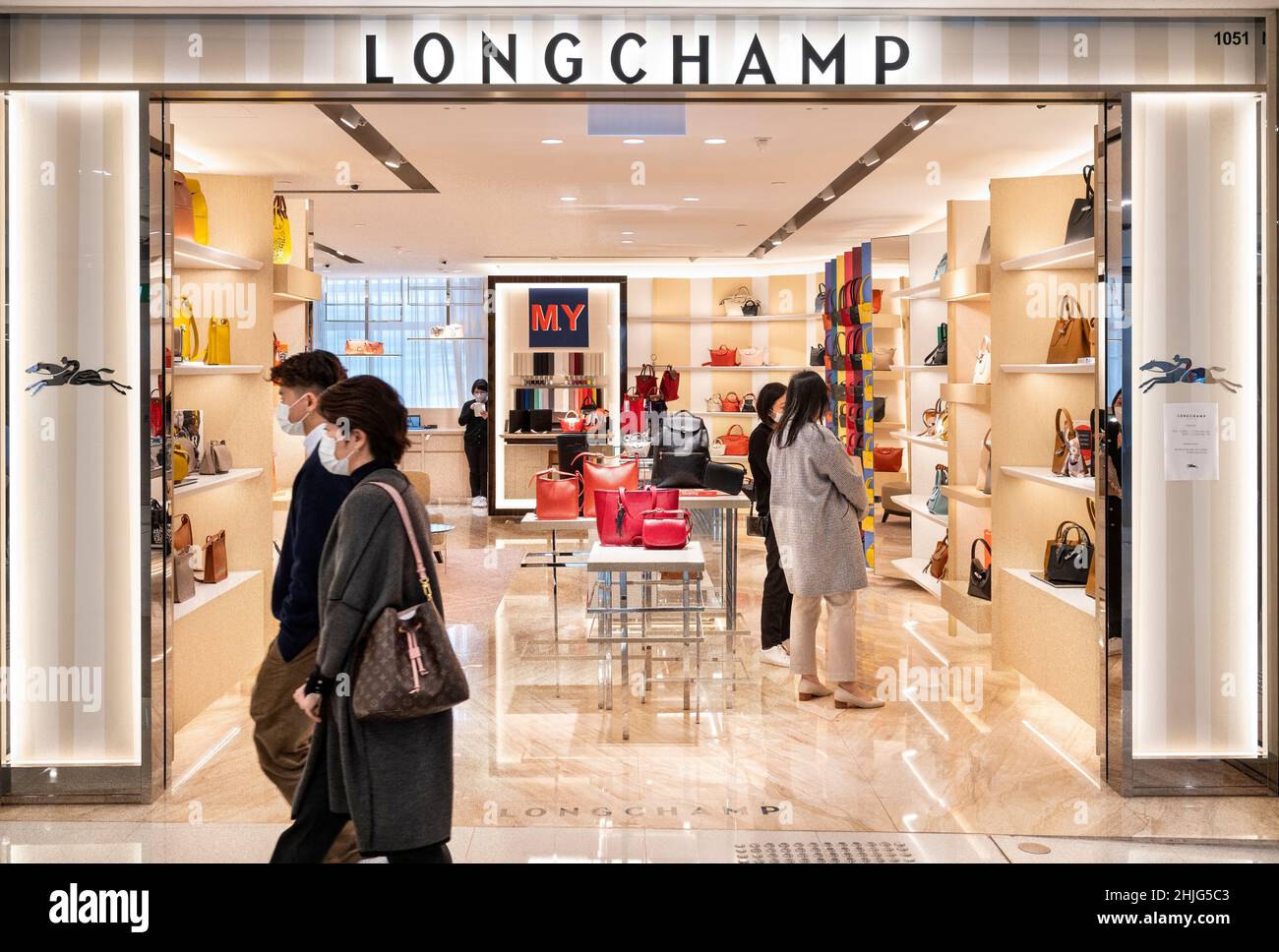 Shoppers walk past the French luxury fashion brand Longchamp store in Hong Kong. Photo by Chukrut Budrul SOPA Images Sipa USA Stock Photo Alamy
