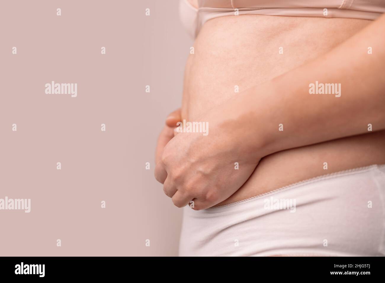 Very fat man demonstrate his big belly Stock Photo - Alamy