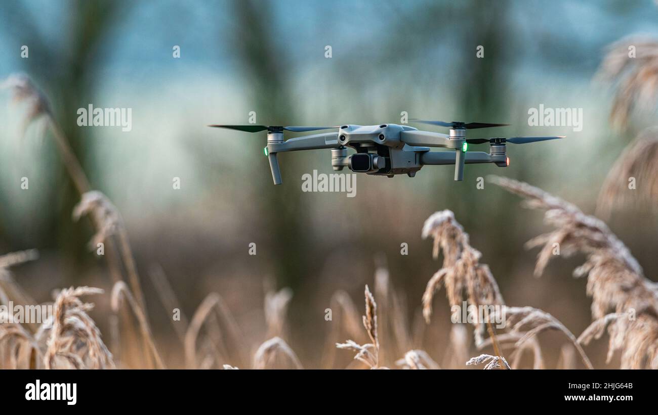 Drone in flight over marshland, Devon, England Stock Photo