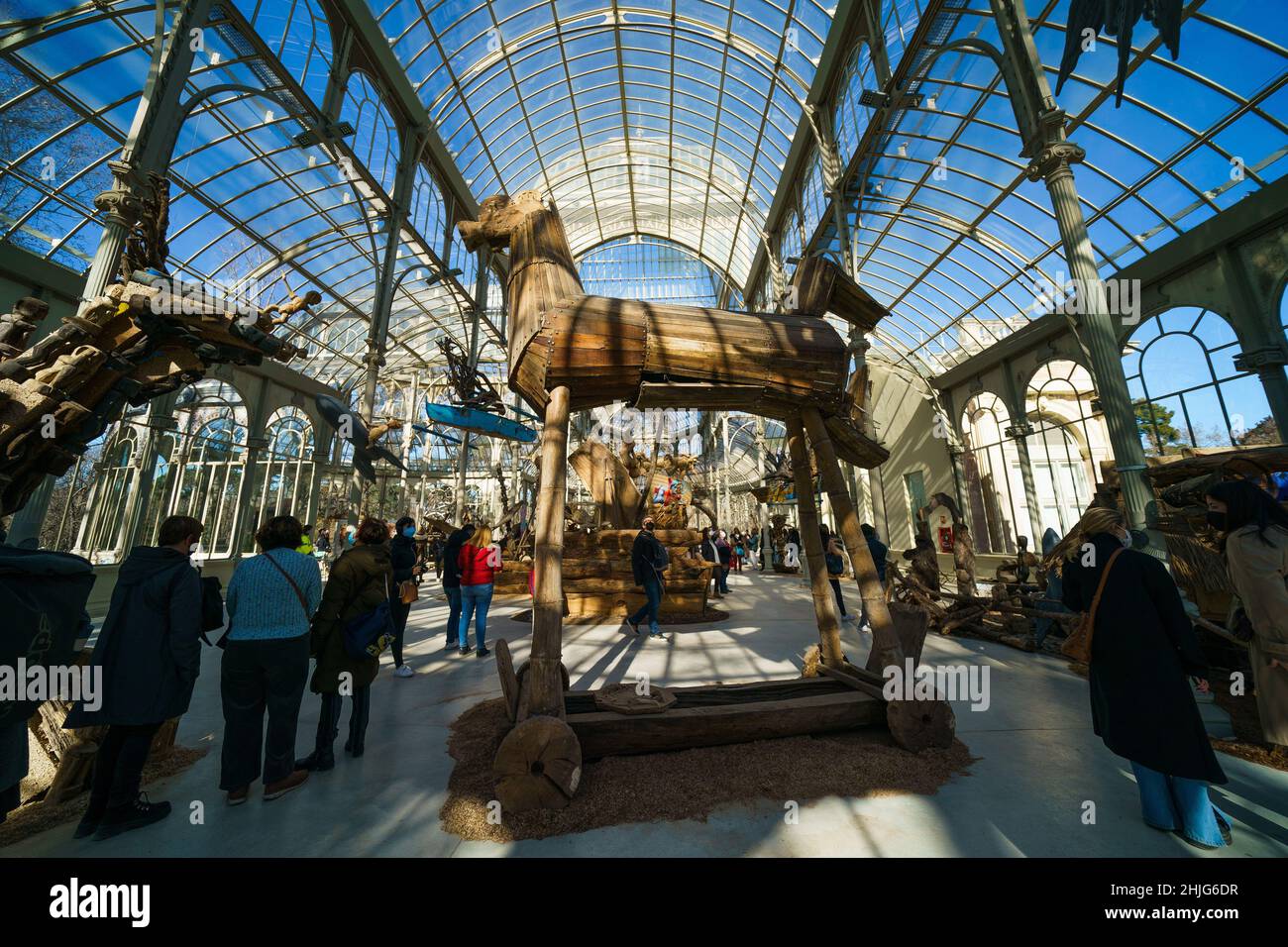 Madrid, Spain. 29th Jan, 2022. An overview of the figures that make up the exhibition 'Magellan, Marilyn, Mickey and Friar Damaso. 500 years of conquistadors RockStars', by the artist Kidlat Tahimik, at the Palacio de Cristal del Parque de El Retiro in Madrid, In this exhibition made up of wooden figures Tahimik reflects on the indigenous resistance and the cultural imposition of the imperial powers, while at the same time he proposes, with irony, an alternative narration of History to the one written by the victors. Credit: ZUMA Press, Inc./Alamy Live News Stock Photo