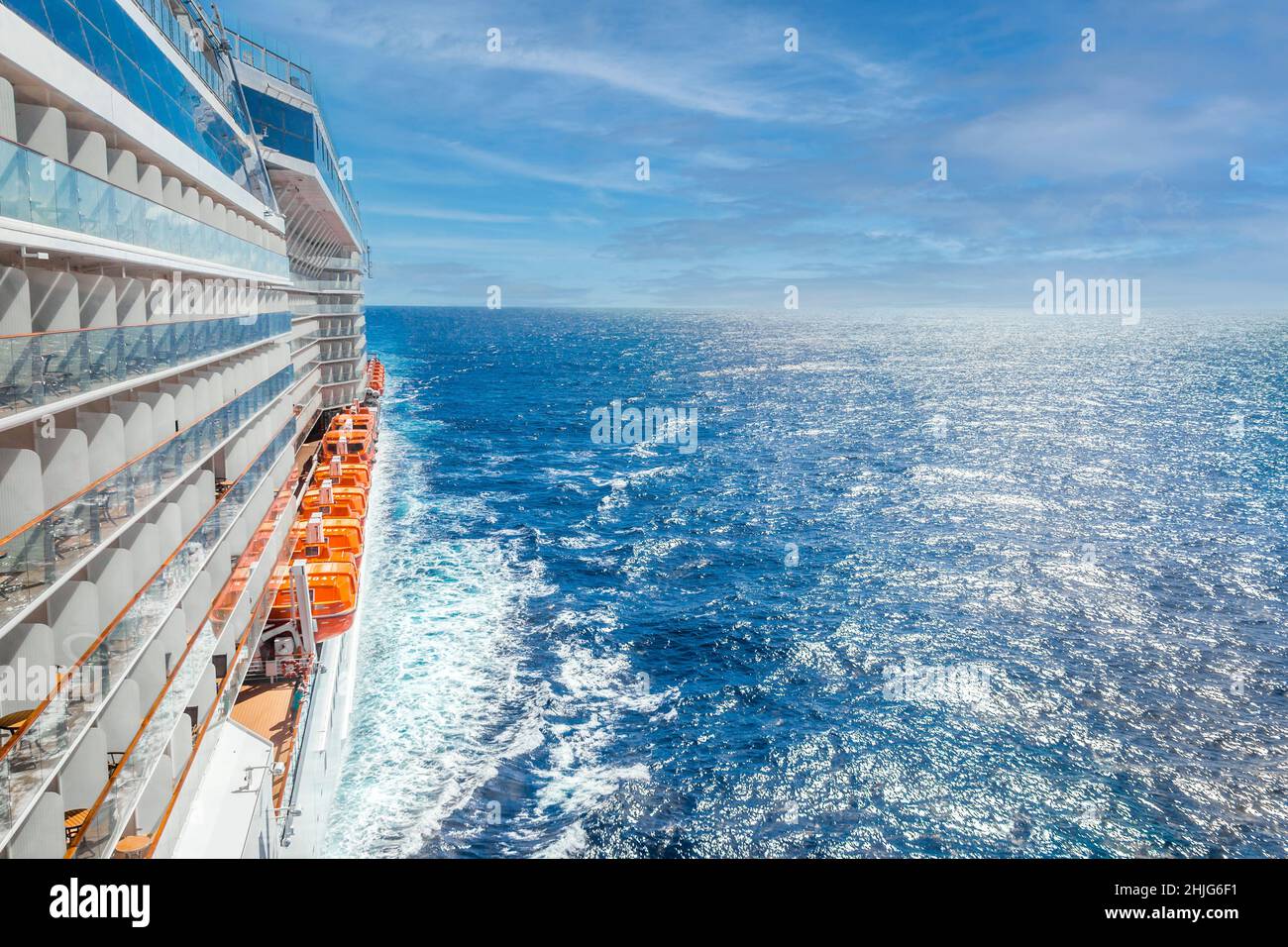 Ocean view from a cruise ship deck on a bright day with blue skies and ...