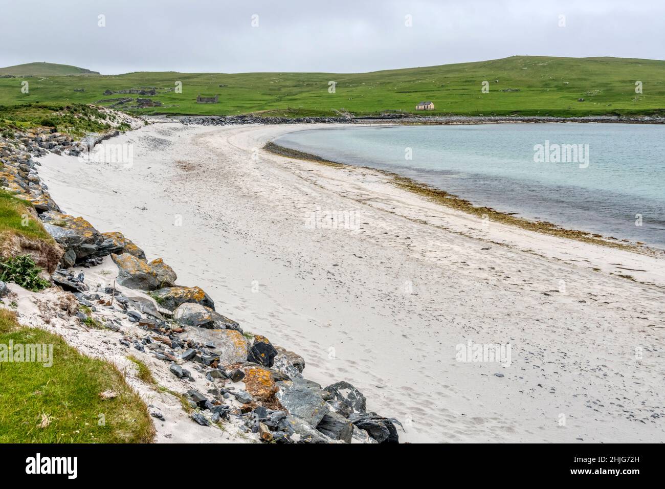 Minn beach on the north side of the tombolo joining Kettla Ness (in distance) to West Burra, Shetland. Stock Photo