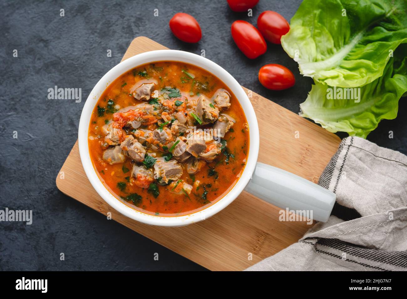 Chicken stomachs stewed in tomato sauce with vegetables Stock Photo Alamy
