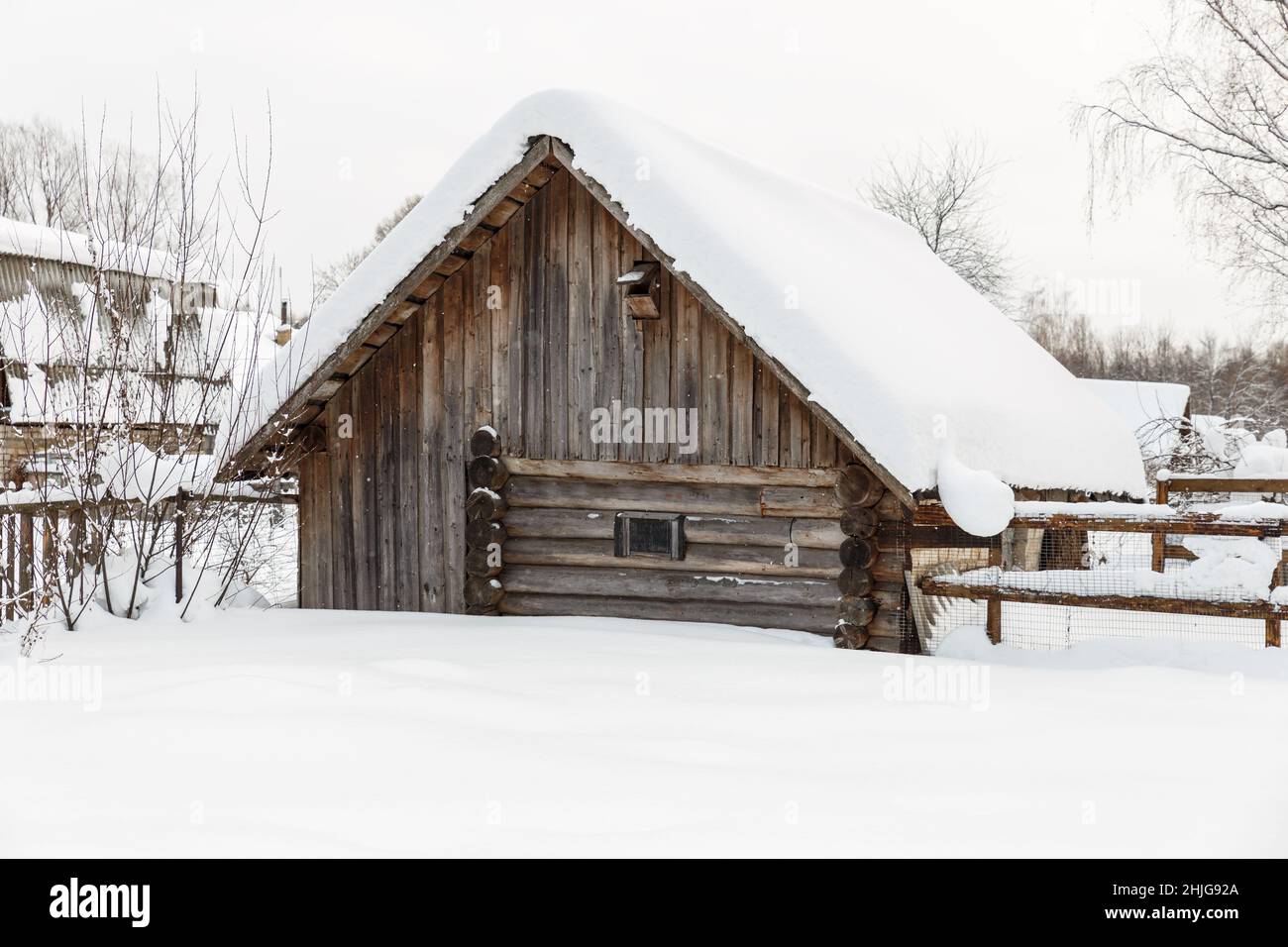 Wooden barn for animals. Log barn in the village in winter Stock Photo ...