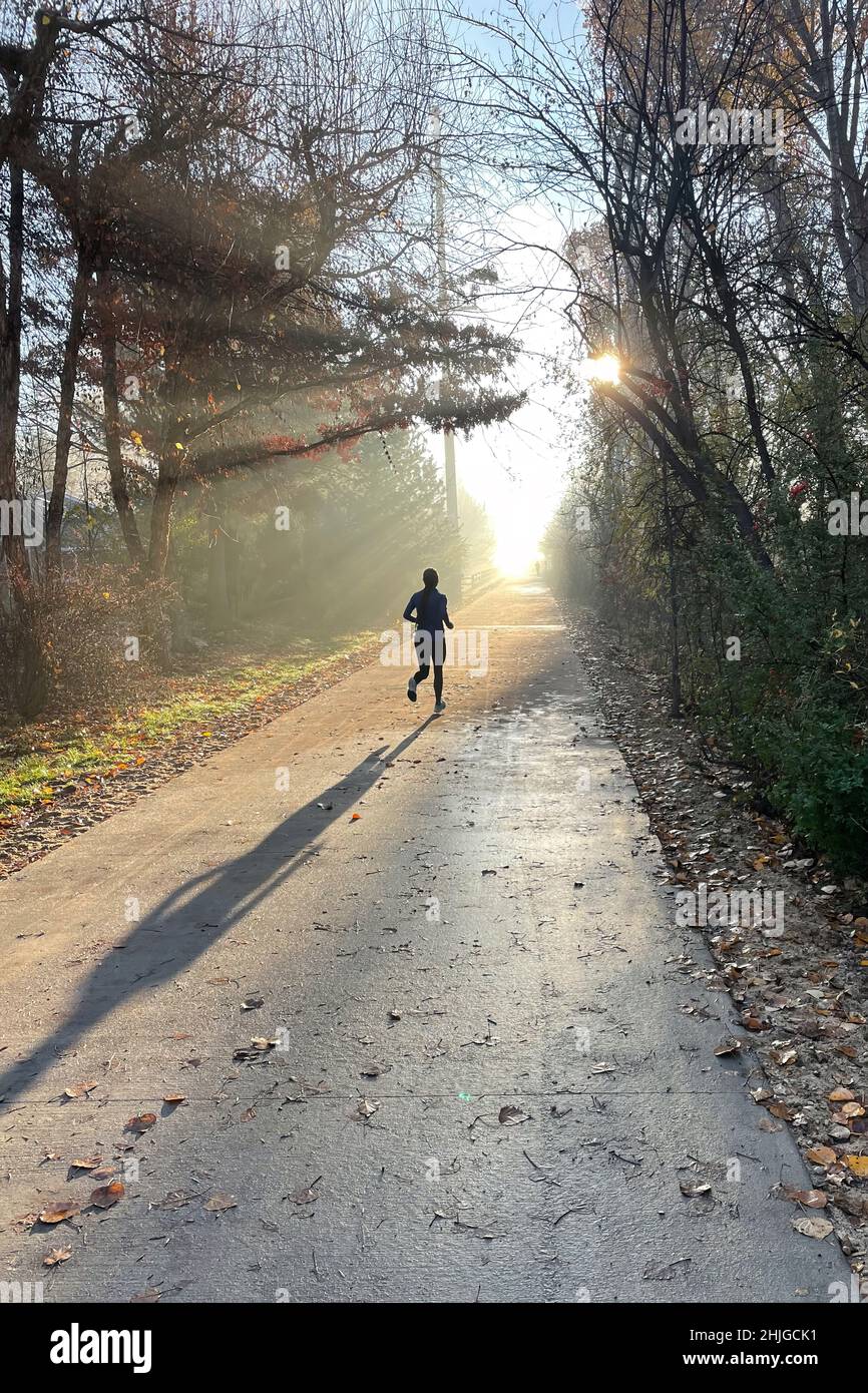 Runner on Boise's Greenbelt on an autumn morning. Stock Photo
