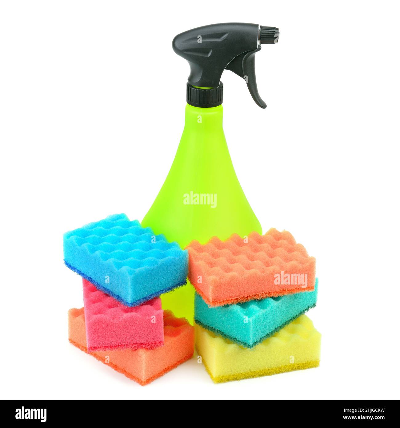 A spray of cleaning agents and household foam rubber sponges isolated