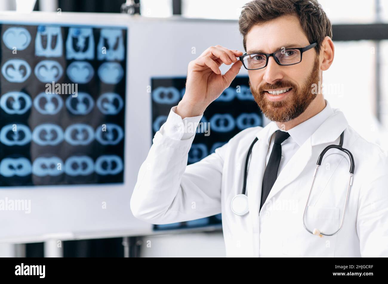 Medicine and healthcare concept. Proud smart male doctor, general