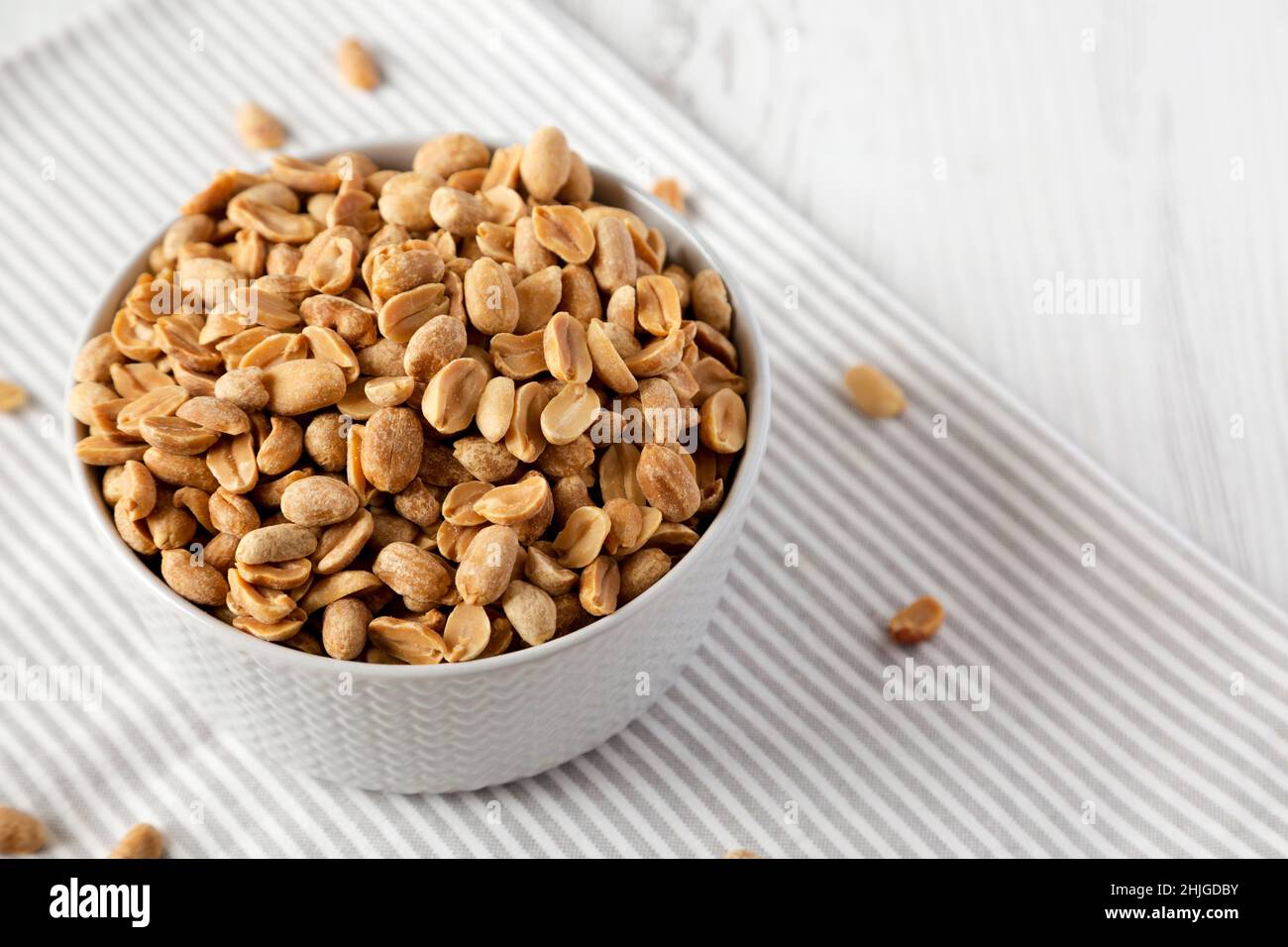 Roasted Salted Shelled Peanuts, side view. Space for text Stock Photo