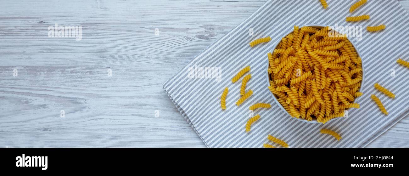 Raw Dry Organic Rotini Pasta Ready to Cook. Top view, from above, flat